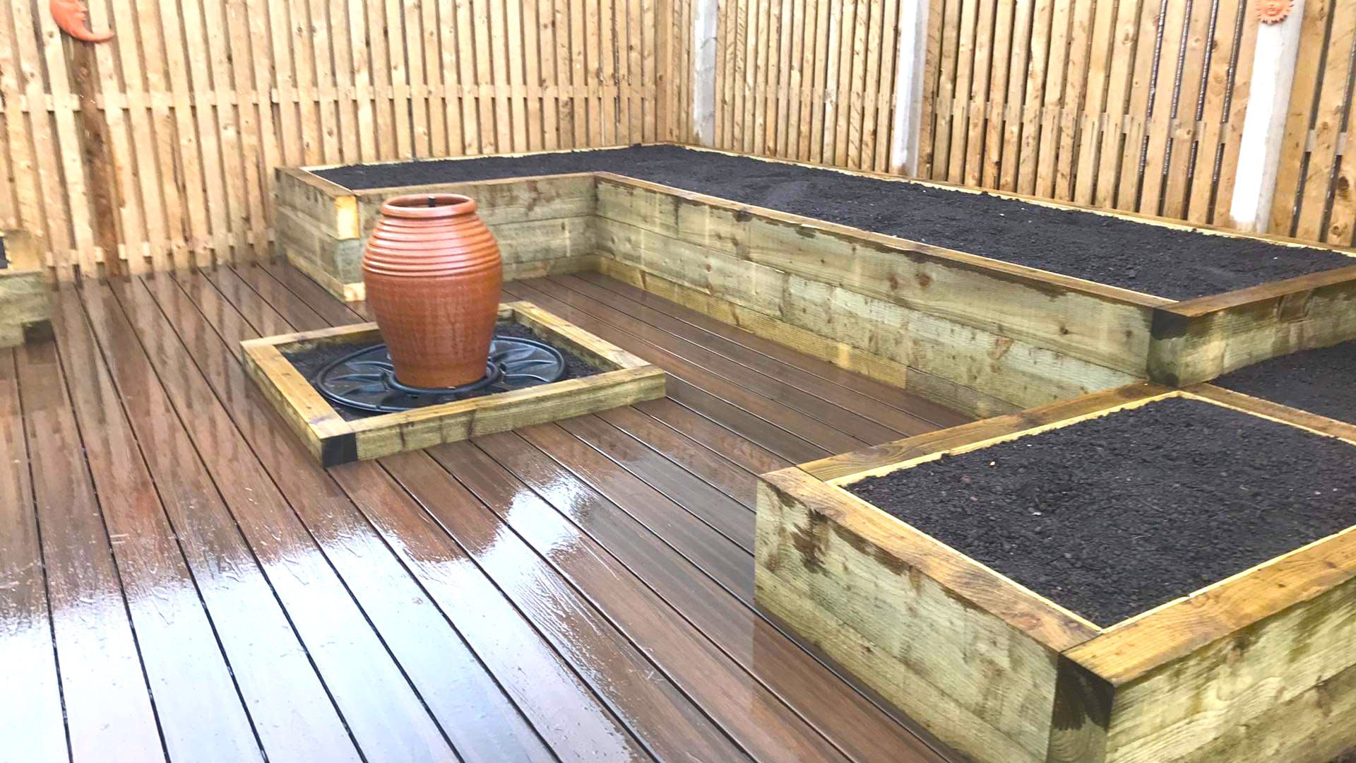 Raised bed with composit decking and water feature 1 2