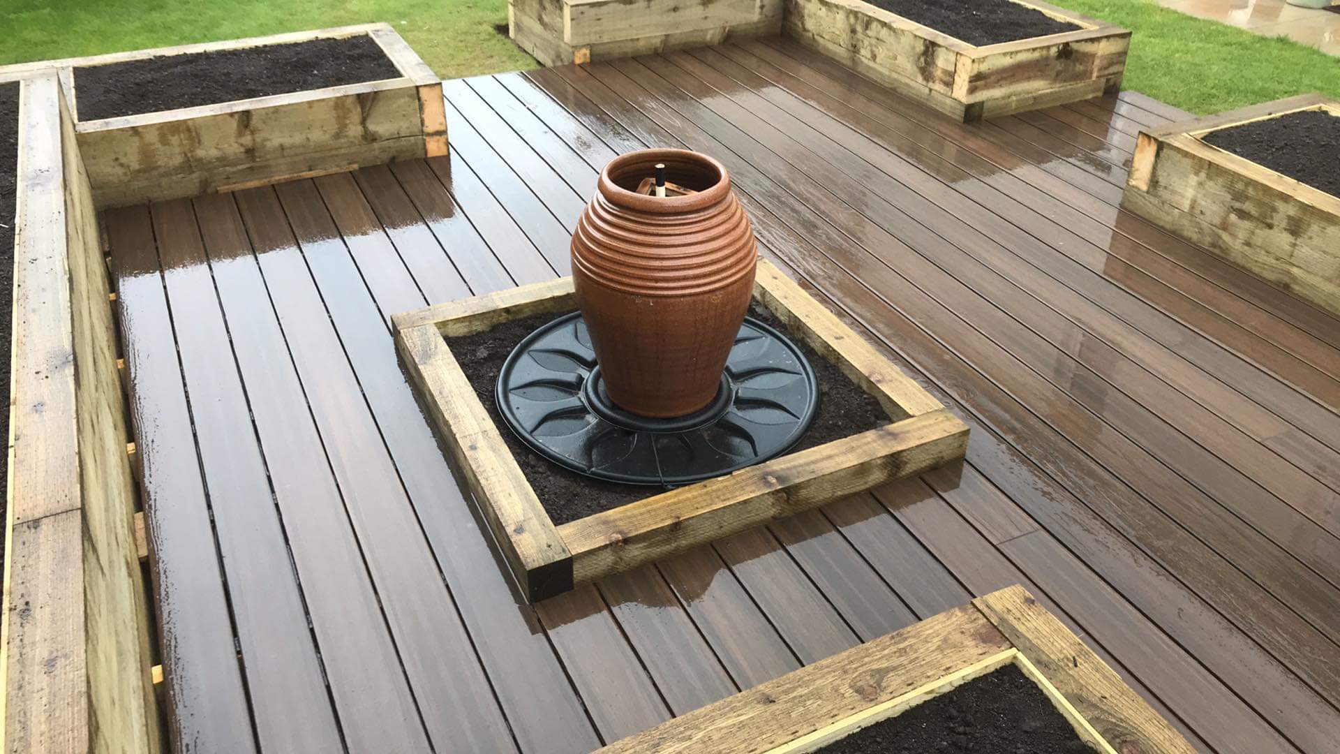 Raised bed with composit decking and water feature 1