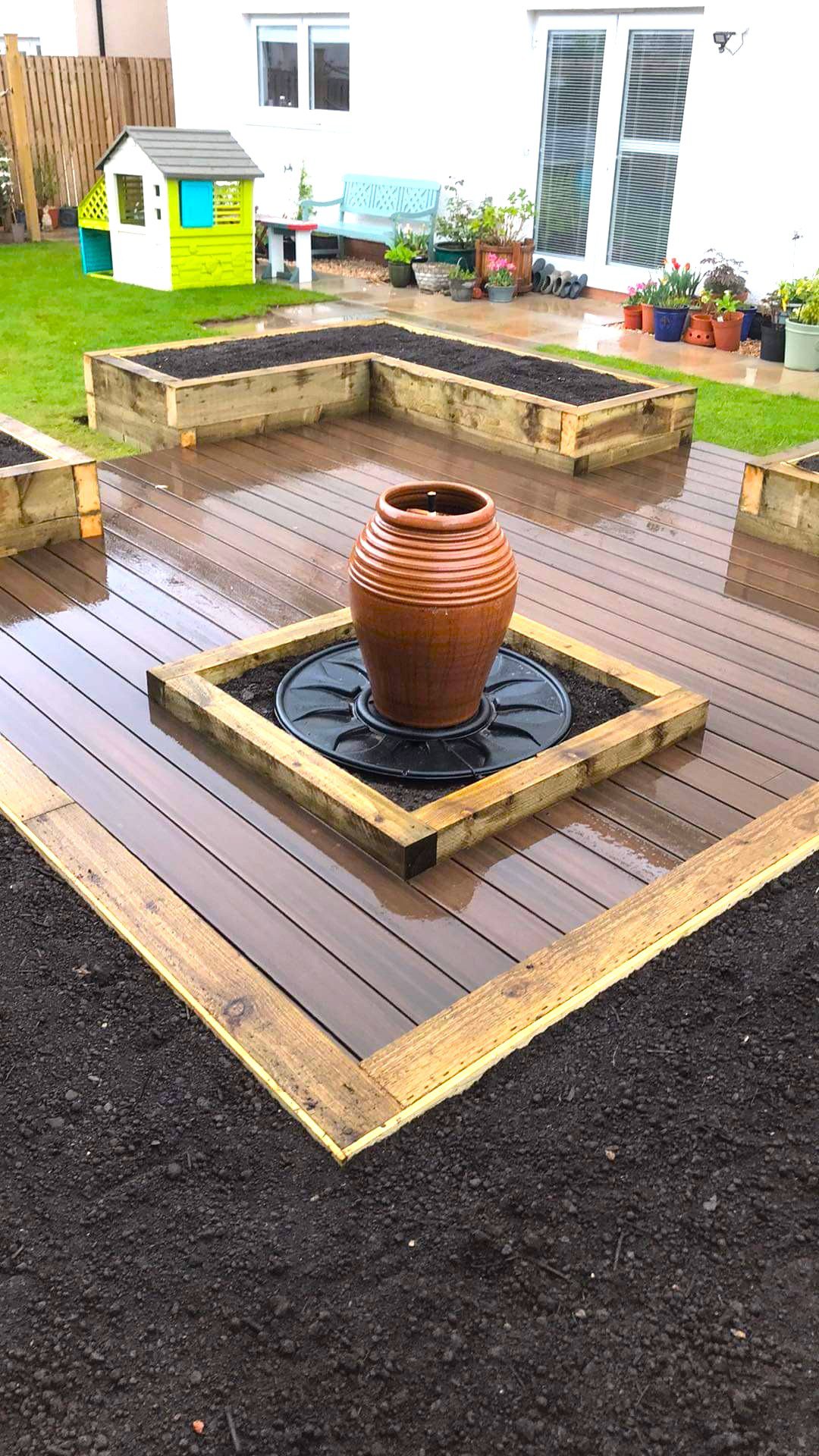 Raised bed with composit decking and water feature 7